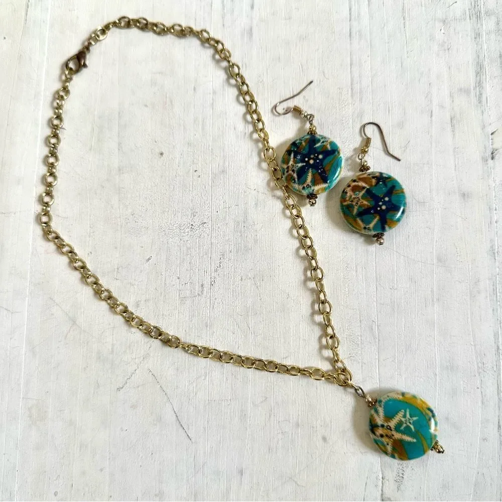 Gold tone blue starfish necklace and earrings set